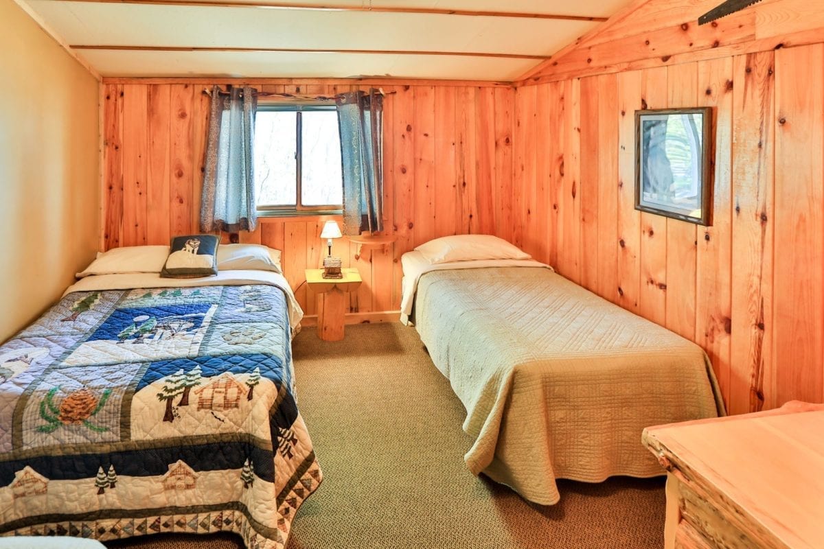 Moose Lodge bedroom with two beds.