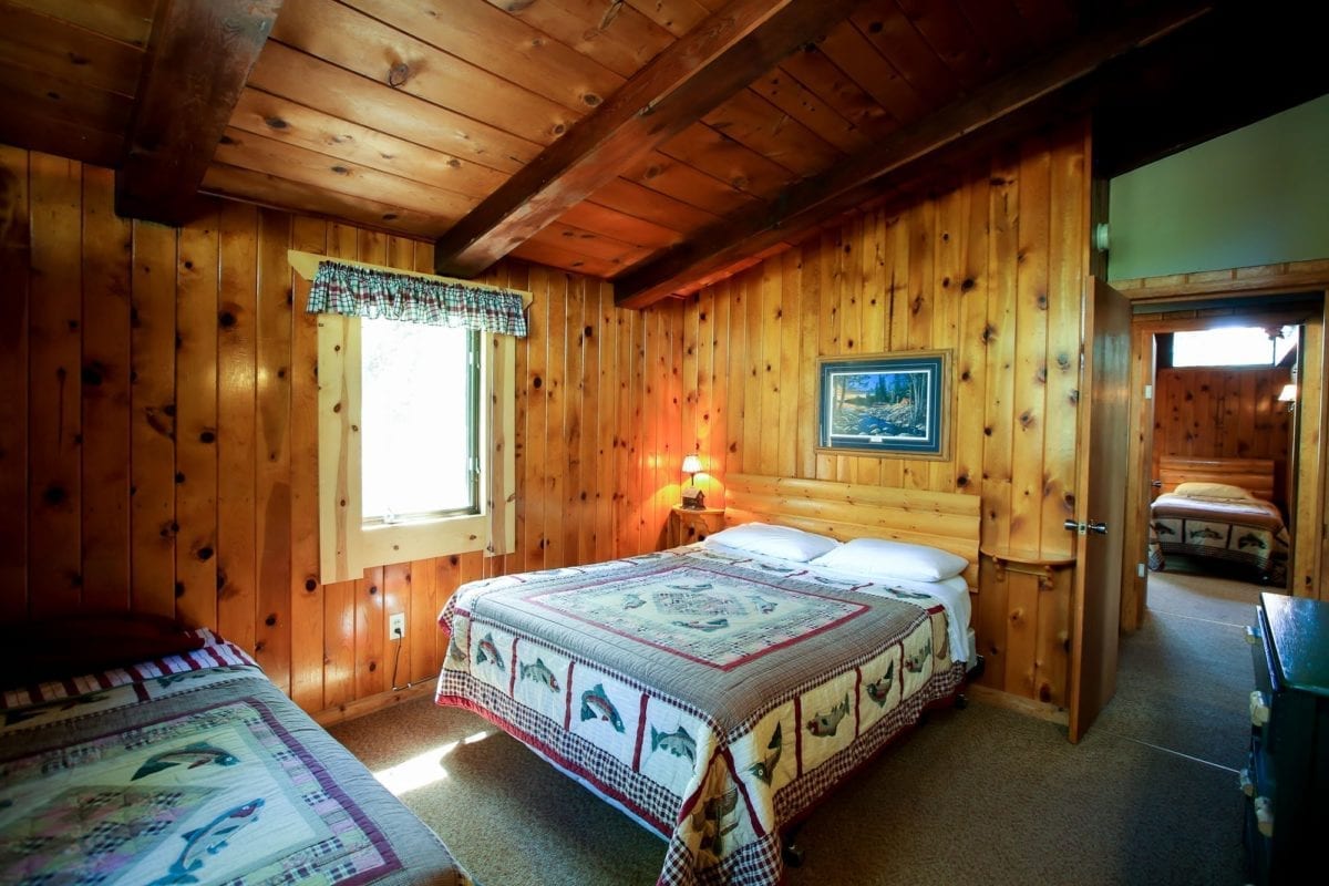Northern Cabin bedroom with two beds.