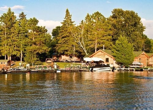 View of resort cabins and dock from the lake.