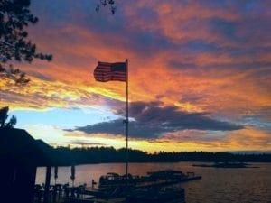 Sunset on Lake Kabetogama and American flag.