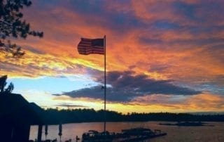 Sunset on Lake Kabetogama and American flag.