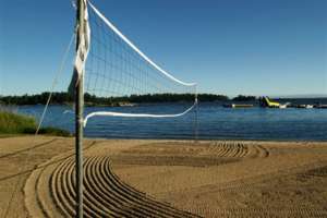 Beach with volleyball net.