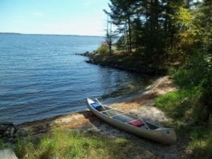Boating is a favorite activity on Lake Kabetogama. Seen here is one of our rental canoe boats on a private island campsite.