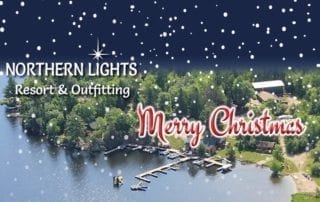 Aerial view of Northern Lights Resort and Lake Kabetogama. text: Merry Christmas.