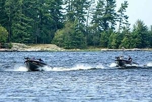 Speeding boats on the lake.