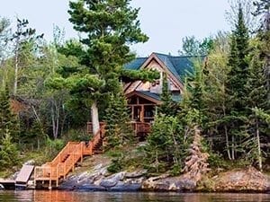 View of a cabin from the lake.