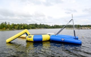 Inflated lake trampoline and slide.