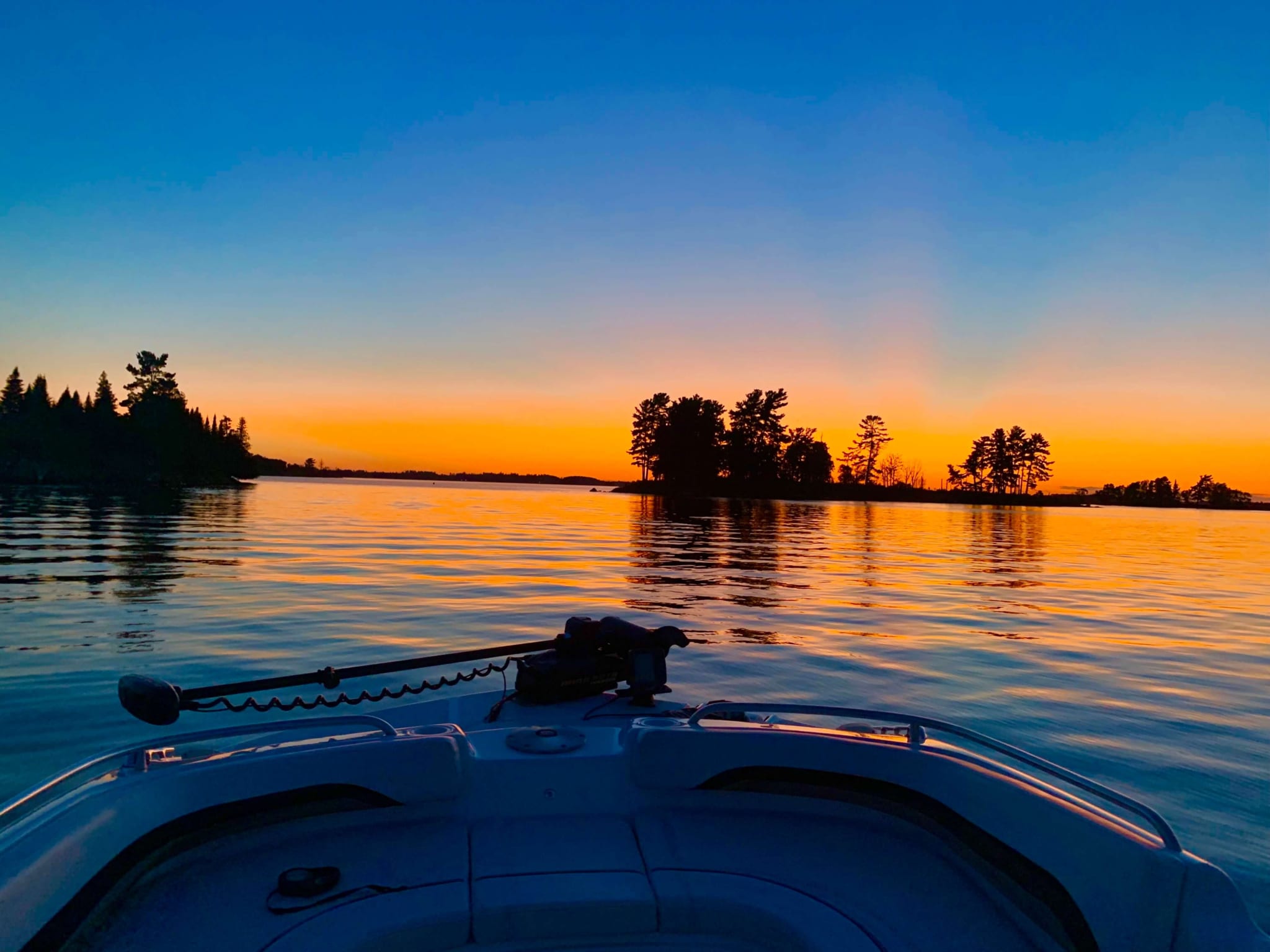 Watching the sunset in a boat on the lake